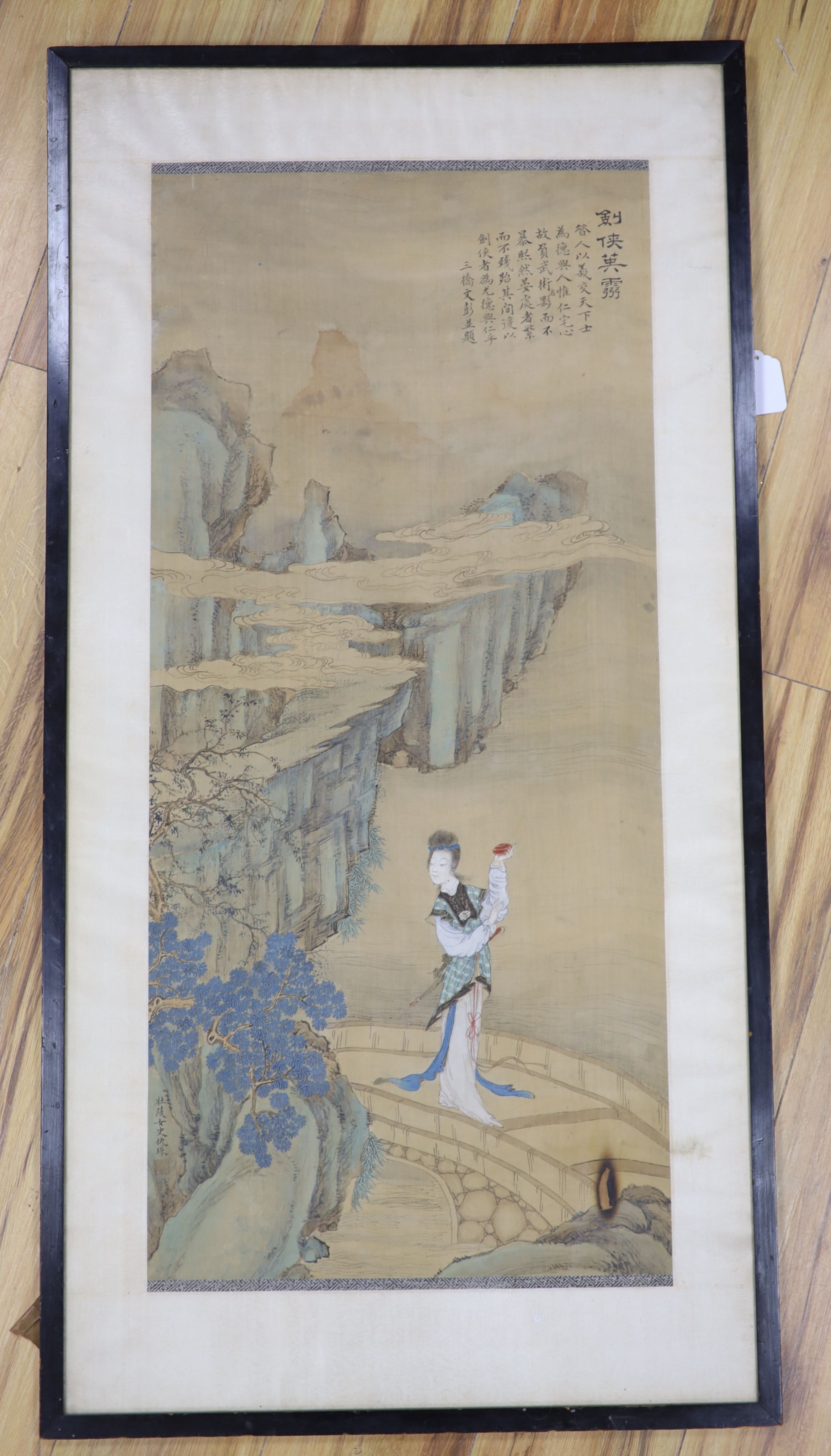 A large Chinese watercolour on silk, late 19th/early 20th century, woman in a landscape, signed, 91 x 42cm.